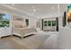 Airy main bedroom with sitting area, white walls, neutral tones, and plenty of windows for natural light at 1938 Filly Trl, Oviedo, FL 32765