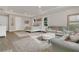 Spacious main bedroom with a sitting area, wooden floors, and large windows for natural light at 1938 Filly Trl, Oviedo, FL 32765
