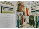 Organized walk-in closet with built-in shelving, drawers, and ample hanging space for clothing and accessories at 1938 Filly Trl, Oviedo, FL 32765