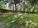Expansive backyard enclosed by a brick wall, providing a private outdoor retreat at 2020 Rushden Dr, Ocoee, FL 34761