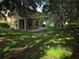 Large backyard featuring a covered patio, perfect for outdoor entertaining and relaxation at 2020 Rushden Dr, Ocoee, FL 34761