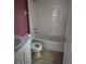 Bathroom featuring tub-shower combination, white vanity, and tiled flooring at 2020 Rushden Dr, Ocoee, FL 34761