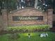 Westchester community entrance sign with manicured landscaping and brick facade at 2020 Rushden Dr, Ocoee, FL 34761
