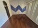 Dining Room with hard wood floors and modern accent wall at 2020 Rushden Dr, Ocoee, FL 34761