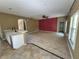 Open concept living room featuring tile flooring and abundant natural light at 2020 Rushden Dr, Ocoee, FL 34761
