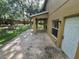Covered patio area with door to back exterior and view of large yard at 2020 Rushden Dr, Ocoee, FL 34761