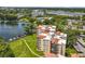 Aerial view of condo buildings with lush landscaping and lake at 204 Quayside Cir # 601, Maitland, FL 32751