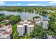 Beautiful lakefront condo building with lush green landscaping and stunning views from every unit at 204 Quayside Cir # 601, Maitland, FL 32751