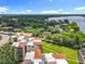 Aerial view of condo complex with a red tile roof near a lake at 204 Quayside Cir # 601, Maitland, FL 32751
