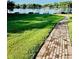Backyard featuring a brick pathway and a lake with boats docked at 204 Quayside Cir # 601, Maitland, FL 32751