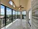 Enclosed balcony with tiled flooring, arched window and numerous windows providing plenty of natural light at 204 Quayside Cir # 601, Maitland, FL 32751