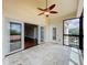 Balcony with tile flooring, sliding glass doors to the interior, and windows overlooking the community at 204 Quayside Cir # 601, Maitland, FL 32751