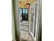 View through doorway to balcony with serene views at 204 Quayside Cir # 601, Maitland, FL 32751
