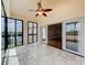 Enclosed balcony with tile floors and several windows overlooking the waterfront at 204 Quayside Cir # 601, Maitland, FL 32751