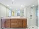 Stylish bathroom with double sinks, marble countertop, and frameless glass shower at 204 Quayside Cir # 601, Maitland, FL 32751