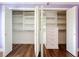 Bedroom closet includes custom shelves and drawer unit on wood flooring at 204 Quayside Cir # 601, Maitland, FL 32751