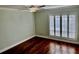 Bedroom with ceiling fan and shuttered windows for natural light at 204 Quayside Cir # 601, Maitland, FL 32751