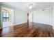 Bedroom featuring hardwood floors, ceiling fan, and access to an enclosed porch at 204 Quayside Cir # 601, Maitland, FL 32751