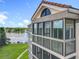 Condo exterior with enclosed balcony overlooking lake at 204 Quayside Cir # 601, Maitland, FL 32751