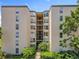 Well-maintained condo building with a center walkway and lush greenery creating a peaceful atmosphere at 204 Quayside Cir # 601, Maitland, FL 32751