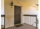 View of a unit front door with a welcome mat and exterior lighting at 204 Quayside Cir # 601, Maitland, FL 32751