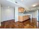 Open kitchen with shaker cabinets, light countertops, backsplash, and stainless-steel appliances at 204 Quayside Cir # 601, Maitland, FL 32751