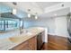 Charming kitchen features granite countertops, stainless appliances and a view into the living area at 204 Quayside Cir # 601, Maitland, FL 32751