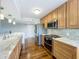 Well-lit kitchen with stainless steel appliances, light-toned cabinets, and marble countertops at 204 Quayside Cir # 601, Maitland, FL 32751