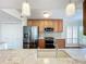 Bright kitchen showcasing stainless steel appliances and plenty of cabinet space at 204 Quayside Cir # 601, Maitland, FL 32751
