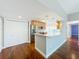 Bright kitchen features an island, stainless steel appliances, wood floors, and neutral paint at 204 Quayside Cir # 601, Maitland, FL 32751