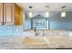 Bright, modern kitchen with marble countertop, stainless steel appliances, and open layout to the living area at 204 Quayside Cir # 601, Maitland, FL 32751