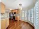 Open kitchen featuring stainless steel appliances, cabinets, and natural light at 204 Quayside Cir # 601, Maitland, FL 32751