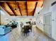 Spacious living room featuring wood ceiling, tile floor, and ample seating at 204 Quayside Cir # 601, Maitland, FL 32751