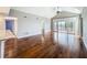 Bright living room featuring hardwood floors, recessed lights, vaulted ceiling and sliding doors to the outdoor balcony at 204 Quayside Cir # 601, Maitland, FL 32751