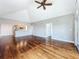 Open-concept living space with hardwood floors, vaulted ceiling, and pass-through bar to the kitchen at 204 Quayside Cir # 601, Maitland, FL 32751