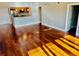 Bright living room featuring hardwood floors, and an open floor plan to the kitchen at 204 Quayside Cir # 601, Maitland, FL 32751