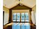 Living room with vaulted ceiling, ceiling fan and sliding glass doors at 204 Quayside Cir # 601, Maitland, FL 32751