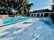 Community pool with lounge chairs and a clear blue swimming pool at 204 Quayside Cir # 601, Maitland, FL 32751