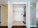 Utility closet featuring water heater, washer and dryer hook-ups, and shelving at 204 Quayside Cir # 601, Maitland, FL 32751