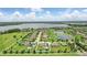 Aerial view of home with swimming pool, set in a well-maintained community by the lake at 2118 Whiting Trl, Orlando, FL 32820