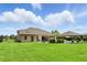 Large backyard featuring a well-manicured lawn, outdoor lounge furniture and patio area at 2118 Whiting Trl, Orlando, FL 32820