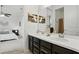 Bathroom vanity boasts dual sinks, modern fixtures, and ample storage space at 2118 Whiting Trl, Orlando, FL 32820