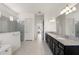 Bathroom featuring double vanity with granite countertops and walk-in shower at 2118 Whiting Trl, Orlando, FL 32820