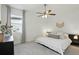 Cozy bedroom featuring neutral tones, a comfortable bed, and a ceiling fan at 2118 Whiting Trl, Orlando, FL 32820