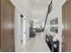 Grand foyer with high ceilings, elegant staircase, and open view into the living spaces at 2118 Whiting Trl, Orlando, FL 32820