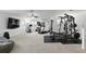 Expansive home gym with full workout equipment, perfect for fitness enthusiasts at 2118 Whiting Trl, Orlando, FL 32820