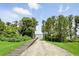 Easy lake access via a wooden walkway and boat ramp, surrounded by lush greenery at 2118 Whiting Trl, Orlando, FL 32820