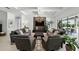 Spacious living room featuring stylish lighting, modern decor, and backyard view at 2118 Whiting Trl, Orlando, FL 32820