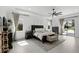 Light filled main bedroom with ceiling fan, ensuite bathroom, and sliding glass doors at 2118 Whiting Trl, Orlando, FL 32820
