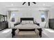 Spacious main bedroom featuring tray ceilings, neutral decor, and ample natural light at 2118 Whiting Trl, Orlando, FL 32820